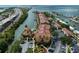 Expansive aerial view showcasing waterfront condos with boat docks, a pool, and convenient access to nearby highways at 5000 Culbreath Key Way # 4-306, Tampa, FL 33611