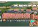 Aerial view highlighting waterfront condos with private boat docks, parking, and a community pool at 5000 Culbreath Key Way # 4-306, Tampa, FL 33611