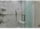 Modern bathroom with marble tile shower and glass door at 5000 Culbreath Key Way # 4-306, Tampa, FL 33611