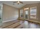 Bright bedroom with wood floors, a ceiling fan, and two windows for natural light at 5000 Culbreath Key Way # 4-306, Tampa, FL 33611