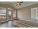 Bright bedroom with wood floors, a ceiling fan, and a door leading to a balcony at 5000 Culbreath Key Way # 4-306, Tampa, FL 33611