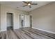 Bedroom with hard floors and ceiling fan has doors to closet and bathroom at 5000 Culbreath Key Way # 4-306, Tampa, FL 33611