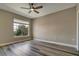 Light and bright bedroom with hardwood floors, fresh paint, and a view to the natural surroundings at 5000 Culbreath Key Way # 4-306, Tampa, FL 33611