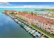 Beautiful exterior view of condo community showing docks and boat slips with access to the waterway at 5000 Culbreath Key Way # 4-306, Tampa, FL 33611