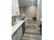 Modern kitchen featuring white cabinetry and stainless steel appliances, stylish countertop at 5000 Culbreath Key Way # 4-306, Tampa, FL 33611