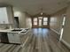 Spacious living room with hardwood flooring and a view of the outdoor patio at 5000 Culbreath Key Way # 4-306, Tampa, FL 33611