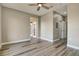 Open living room featuring light hardwood floors and a neutral color scheme at 5000 Culbreath Key Way # 4-306, Tampa, FL 33611