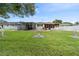 Large backyard with green grass and house view at 201 S Duncan Ave, Clearwater, FL 33755