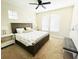 Guest bedroom with king-size bed and ceiling fan at 6515 Virginia Xing, University Park, FL 34201