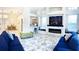 Open-concept living room with fireplace and comfy sofas at 6515 Virginia Xing, University Park, FL 34201