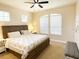 Guest bedroom with king-size bed and ceiling fan at 6515 Virginia Xing, University Park, FL 34201