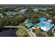 Aerial view of community amenities, including clubhouse and tennis courts at 6515 Virginia Xing, University Park, FL 34201
