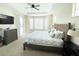 Main bedroom with king bed and access to backyard at 6515 Virginia Xing, University Park, FL 34201