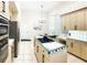 Island kitchen with stainless steel appliances at 6515 Virginia Xing, University Park, FL 34201