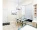 Kitchen breakfast nook with window seat and glass table at 6515 Virginia Xing, University Park, FL 34201