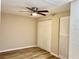 Bright bedroom with ceiling fan and double closets at 3245 Bigelow Dr Dr, Holiday, FL 34691