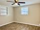 Bedroom with wood-look floors, built-in shelving at 3245 Bigelow Dr Dr, Holiday, FL 34691