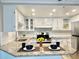 Modern kitchen featuring white cabinets and granite countertops at 3245 Bigelow Dr Dr, Holiday, FL 34691