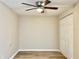 Simple bedroom with wood-look floors and double closet at 3245 Bigelow Dr Dr, Holiday, FL 34691