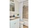 Updated bathroom with tub, shower, and white vanity at 3245 Bigelow Dr Dr, Holiday, FL 34691