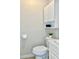 Clean bathroom with white cabinets and a toilet at 3245 Bigelow Dr Dr, Holiday, FL 34691