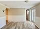 Spacious living area showcasing light neutral walls and wood flooring at 3245 Bigelow Dr Dr, Holiday, FL 34691