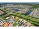 Community overview featuring numerous homes and lakes at 15626 Aurora Lake Cir, Wimauma, FL 33598