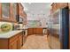 Modern kitchen featuring stainless steel appliances and ample cabinetry at 15626 Aurora Lake Cir, Wimauma, FL 33598