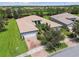 Aerial view of house and surrounding neighborhood at 15626 Aurora Lake Cir, Wimauma, FL 33598