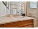 Bathroom with vanity, sink and shower at 15626 Aurora Lake Cir, Wimauma, FL 33598