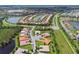 Community features various home styles and lush green spaces at 15626 Aurora Lake Cir, Wimauma, FL 33598
