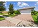 Two-car garage home with nicely landscaped yard at 15626 Aurora Lake Cir, Wimauma, FL 33598