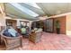 Relaxing community patio with wicker furniture and water feature at 15626 Aurora Lake Cir, Wimauma, FL 33598