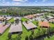 Aerial view of neighborhood with lake at 15626 Aurora Lake Cir, Wimauma, FL 33598
