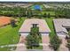 Aerial view of house and surrounding neighborhood at 15626 Aurora Lake Cir, Wimauma, FL 33598