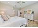 Spacious bedroom with a dresser and two twin beds at 15626 Aurora Lake Cir, Wimauma, FL 33598