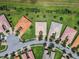 Bird's eye view of homes with unique rooflines and landscaping at 15626 Aurora Lake Cir, Wimauma, FL 33598