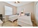 Bedroom with two twin beds, dresser and desk at 15626 Aurora Lake Cir, Wimauma, FL 33598