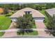 Aerial view of house and surrounding neighborhood at 15626 Aurora Lake Cir, Wimauma, FL 33598