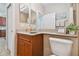 Small bathroom with toilet and vanity at 15626 Aurora Lake Cir, Wimauma, FL 33598
