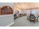 Community card room with tables and chairs for games at 15626 Aurora Lake Cir, Wimauma, FL 33598