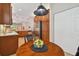 Bright breakfast nook boasts a round table and a view into the kitchen at 15626 Aurora Lake Cir, Wimauma, FL 33598