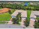Aerial view of house and surrounding neighborhood at 15626 Aurora Lake Cir, Wimauma, FL 33598