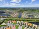 Aerial view of houses and waterways at 15626 Aurora Lake Cir, Wimauma, FL 33598