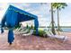 Enjoy the sun or shade in this relaxing poolside lounge at 15626 Aurora Lake Cir, Wimauma, FL 33598