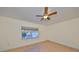 Bright bedroom with tiled floors and a ceiling fan at 521 Pinellas Bayway S # 202, St Petersburg, FL 33715