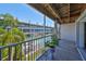 Screened balcony overlooking the community pool and lush landscaping at 521 Pinellas Bayway S # 202, St Petersburg, FL 33715