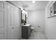 Simple bathroom with single vanity and marble flooring at 4510 S Grady Ave, Tampa, FL 33611