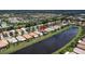 Aerial shot of houses bordering a lake, with a pin dropping on one of the homes at 4949 Sandy Brook Cir, Wimauma, FL 33598