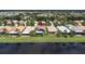 Aerial view of the property with lake view and nearby amenities at 4949 Sandy Brook Cir, Wimauma, FL 33598